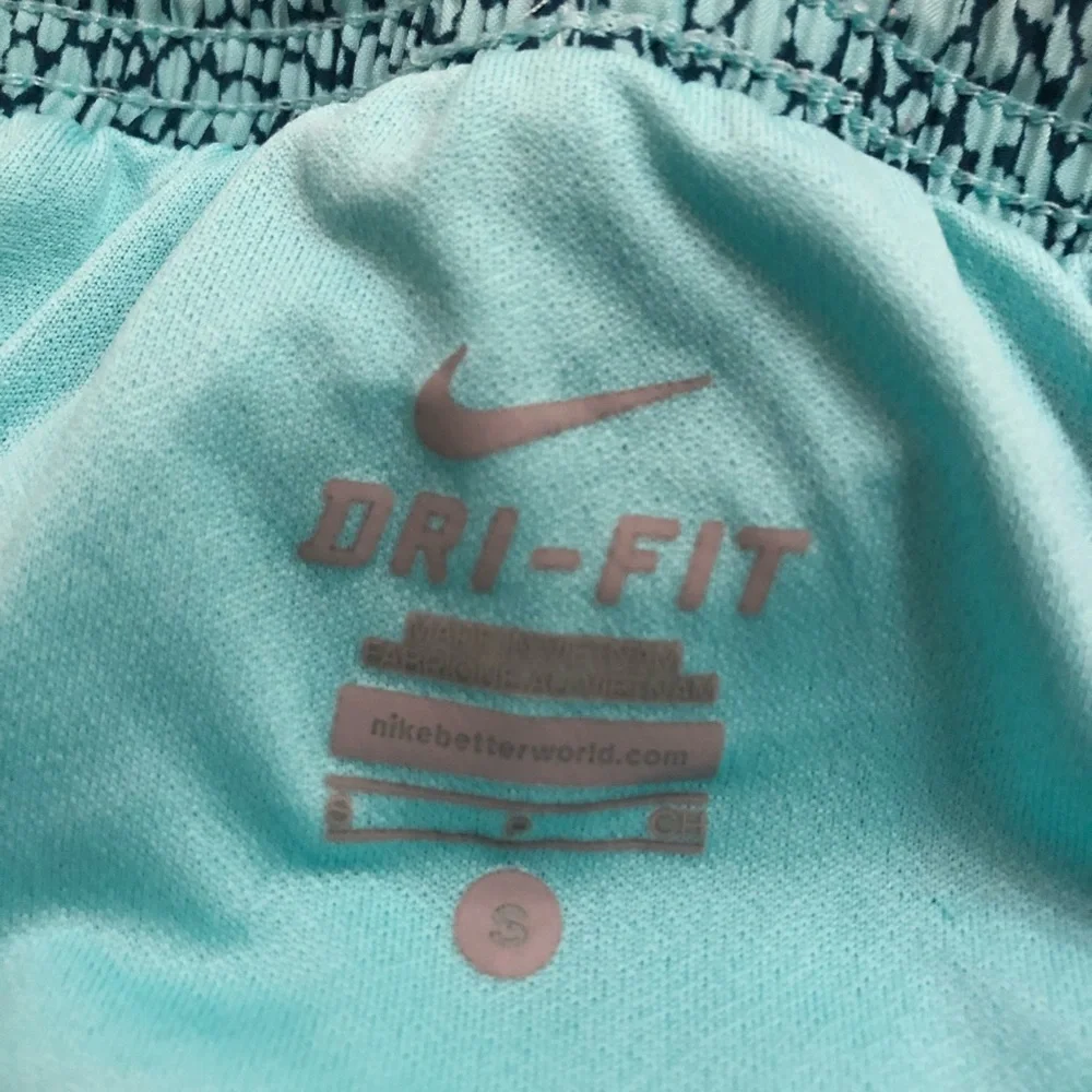 - Nike running shorts. Aqua and teal. Size Small